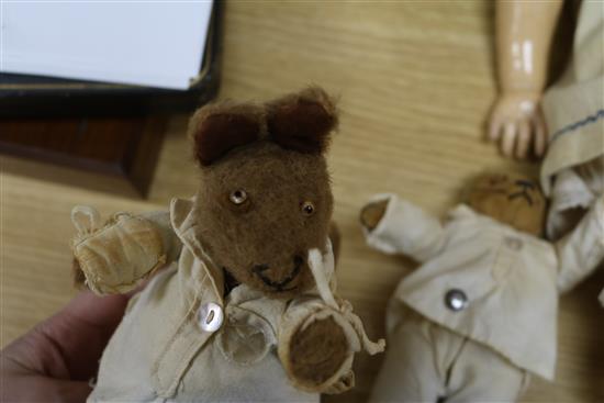 An early 20th century Bisque jointed doll with open mouth and sleeping eyes, and two small plush animals